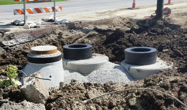 Manhole Grade Adjustment System | WaterWorld