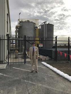 Envirogen&apos;s Dr. Todd Webster in front of the newly started up Fluidized Bed Reactor system. (PRNewsFoto/Envirogen Technologies, Inc.)