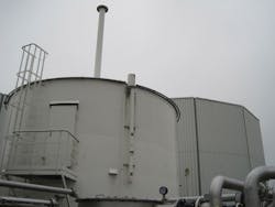 Gas Holding Tank With Digester In Background