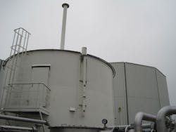 Gas Holding Tank With Digester In Background Gas Holding Tank With Digester In Background
