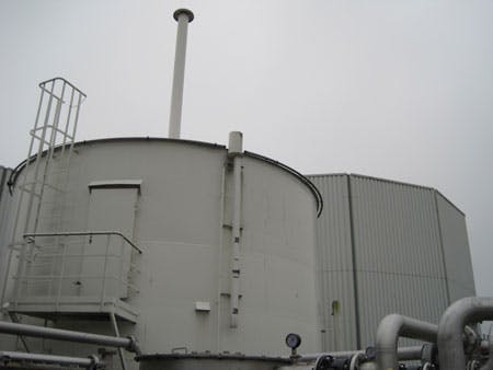 Gas Holding Tank With Digester In Background