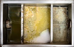 Inside view of a grease trap. Inside view of a grease trap.