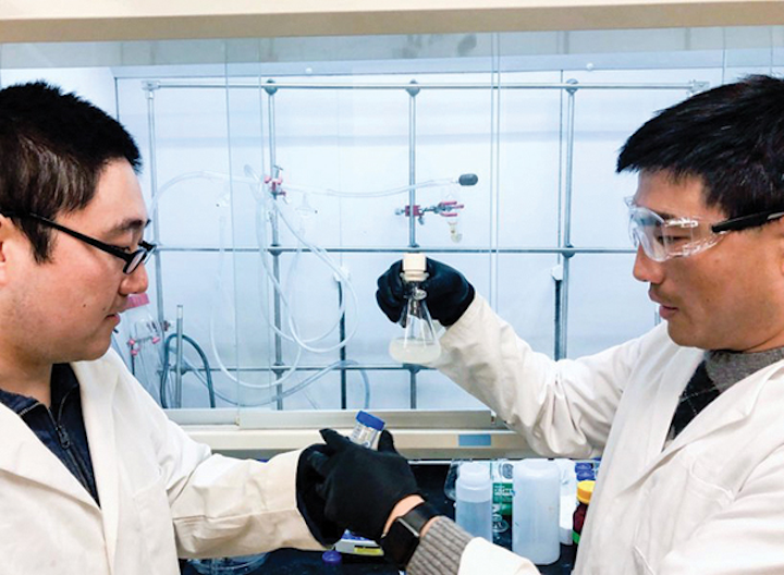 (L-R) Fei Zhao and Guihua Yu of Yu Research Labs at UT Austin examine a sample of their newly-developed hydrogel. Photo Courtesy Cockrell School of Engineering, The University of Texas at Austin.