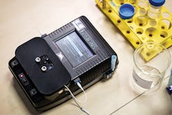 The NTU device works in the field and requires just a few drops of a water sample into a disposable sensor cartridge to detect heavy metals at parts-per-billion precision. Photo Courtesy NTU Singapore. The NTU device works in the field and requires just a few drops of a water sample into a disposable sensor cartridge to detect heavy metals at parts-per-billion precision. Photo Courtesy NTU Singapore.