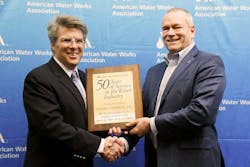 AWWA CEO David LaFrance (left) congratulates Randy Moore, Director of Sales-Agency Development and Industry Affairs and Vice President of the AWWA Board of Directors. AWWA CEO David LaFrance (left) congratulates Randy Moore, Director of Sales-Agency Development and Industry Affairs and Vice President of the AWWA Board of Directors.