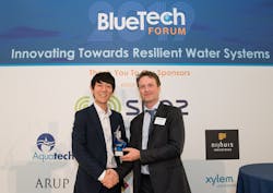 Takashi Kato, president and chief executive of Fracta, receives the award for Best Market Strategy from BlueTech Research chief executive Paul O&apos;Callaghan (r).
