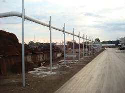 An odor curtain with an elevated header prevents odors from escaping. An odor curtain with an elevated header prevents odors from escaping.