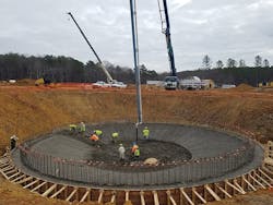 The conical foundation of the thickener tank is poured using a pump and dozens of truckloads of ready-mix concrete from supplier Wayne Davis Concrete. The admixture was premixed in each truck using 15-pound water-&shy;soluble bags.