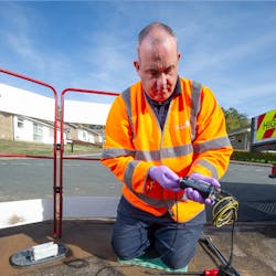 An engineer installs the Enigma3hyQ logger. The loggers are placed permanently into the pipe at convenient fittings such as fire hydrants or dedicated access points. This means greater sensitivity, resulting in more leaks being found more quickly. An engineer installs the Enigma3hyQ logger. The loggers are placed permanently into the pipe at convenient fittings such as fire hydrants or dedicated access points. This means greater sensitivity, resulting in more leaks being found more quickly.