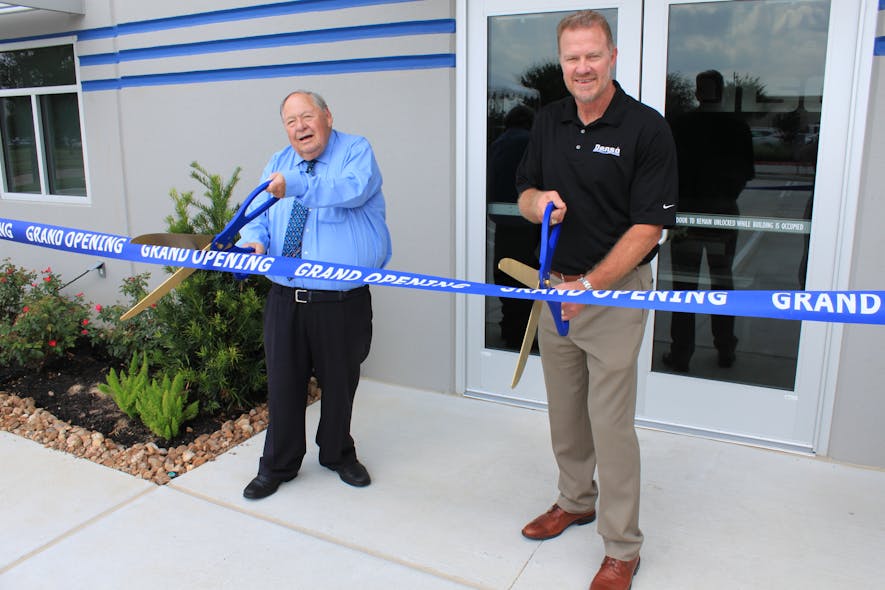 David Winn (Left) Chairman and Lucian Williams (Right) President getting ready to cut the Grand Opening ribbon for the new 11-acre Denso facility.