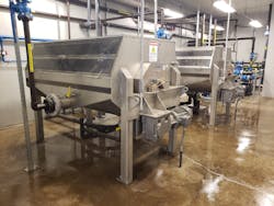 A view of the new BioMag® system magnetite removal drums located at the Bellefonte Borough Authority Wastewater Treatment Plant located in Central Pennsylvania. The innovative BioMag System infuses magnetite (fully oxidized, iron ore particles) into biological floc, enhancing secondary clarification. The magnetic removal drum equipment strips the magnetite from waste sludge before returning the magnetite back to the Activated Sludge process. A view of the new BioMag® system magnetite removal drums located at the Bellefonte Borough Authority Wastewater Treatment Plant located in Central Pennsylvania. The innovative BioMag System infuses magnetite (fully oxidized, iron ore particles) into biological floc, enhancing secondary clarification. The magnetic removal drum equipment strips the magnetite from waste sludge before returning the magnetite back to the Activated Sludge process.