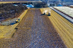Farm Tractor Harvesting On Field 1595106