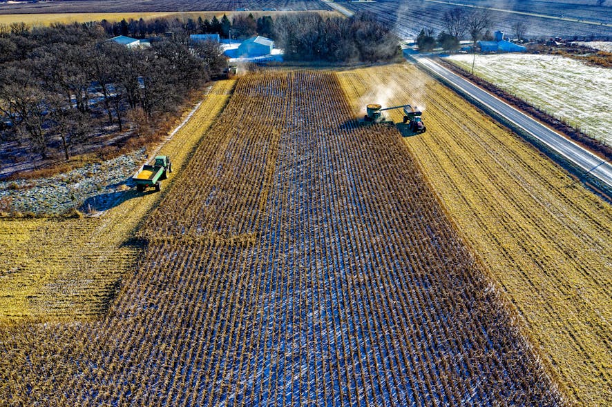 Farm Tractor Harvesting On Field 1595106