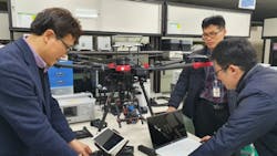 ETRI researchers inspect their hyperspectral camera drone. ETRI researchers inspect their hyperspectral camera drone.