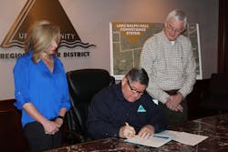Signing Ceremony Photograph (Left to Right): Ronna Hartt, Manager of Water Resources Program; Larry N. Patterson, Executive Director; Ed Motley, Lake Ralph Hall Program Manager. Signing Ceremony Photograph (Left to Right): Ronna Hartt, Manager of Water Resources Program; Larry N. Patterson, Executive Director; Ed Motley, Lake Ralph Hall Program Manager.