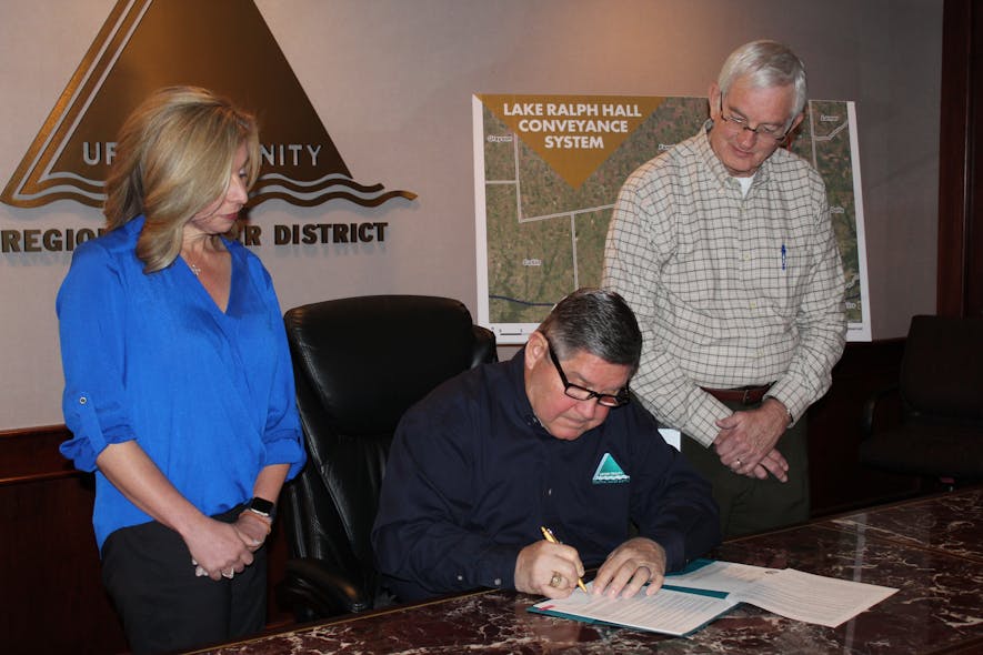 Signing Ceremony Photograph (Left to Right): Ronna Hartt, Manager of Water Resources Program; Larry N. Patterson, Executive Director; Ed Motley, Lake Ralph Hall Program Manager.