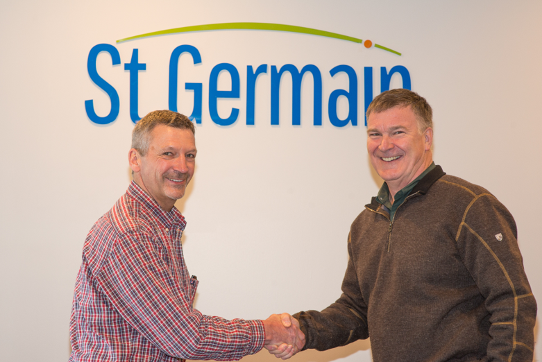 MAI Environmental Founder John Marchewka (left) shakes hands with St.Germain President Mark St.Germain (right).