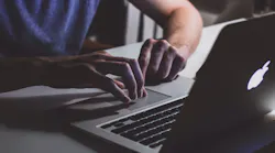 Person Touching Open Macbook On Table 839465