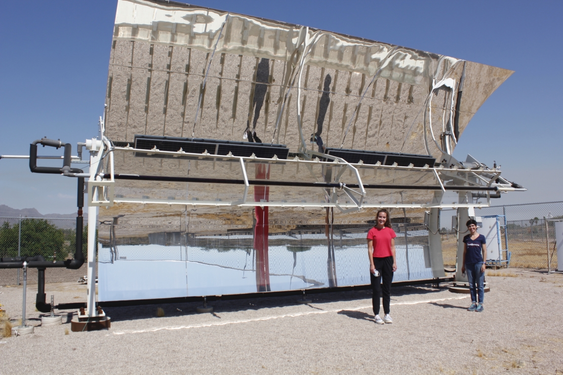 Kerri Hickenbottom (right), assistant professor of chemical and environmental engineering, in front of a solar-powered desalination system with Mikah Inkawhich, a graduate student in environmental engineering and civil and architectural engineering and mechanics. Hickenbottom is leading a team of engineers and scientists to develop a solar-powered desalination system.