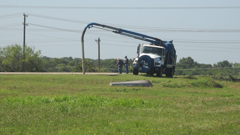 A Pump Truck clearing the discharge line from the Polishing Pond to the Effluent Discharge Basin.