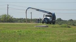 A Pump Truck clearing the discharge line from the Polishing Pond to the Effluent Discharge Basin. A Pump Truck clearing the discharge line from the Polishing Pond to the Effluent Discharge Basin.