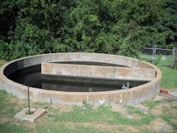 Effluent Discharge Basin and inlet underground valve handle located in line from the Polishing Pond. Effluent Discharge Basin and inlet underground valve handle located in line from the Polishing Pond.