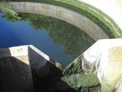 Effluent Discharge Basin V-Notch Weir for discharge flow measurement and Echomax Transducer for level measurement notice the algae build up. Effluent Discharge Basin V-Notch Weir for discharge flow measurement and Echomax Transducer for level measurement notice the algae build up.