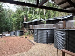 Treated effluent from the AdvanTex® AX-MaxTM system is clean enough to be reused as subsurface irrigation. Left to right, the storage tanks at this off-grid camp contain treated AdvanTex effluent, rainwater for fighting bushfires, and rainwater that will be treated and used as potable water. Treated effluent from the AdvanTex® AX-MaxTM system is clean enough to be reused as subsurface irrigation. Left to right, the storage tanks at this off-grid camp contain treated AdvanTex effluent, rainwater for fighting bushfires, and rainwater that will be treated and used as potable water.