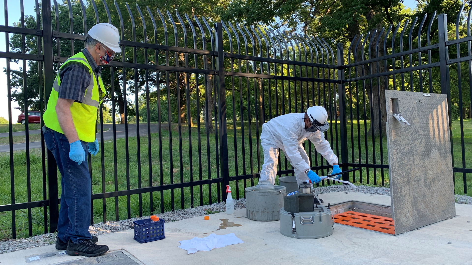 Troy R. Henderson Sr., Louisville/Jefferson County Metropolitan Sewer District water quality engineer, obtains samples of wastewater for the study.