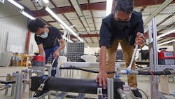 Graduate students Abhimanyu Das (left) and Akshay Rao adjust a piston tank, the key component to a new desalination process called “double-acting batch reverse osmosis.” Graduate students Abhimanyu Das (left) and Akshay Rao adjust a piston tank, the key component to a new desalination process called “double-acting batch reverse osmosis.”
