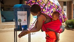 A woman washes her hands upon arrival at Namanolo Health Centre in Balaka Southern Malawi on November 18, 2020. A woman washes her hands upon arrival at Namanolo Health Centre in Balaka Southern Malawi on November 18, 2020.