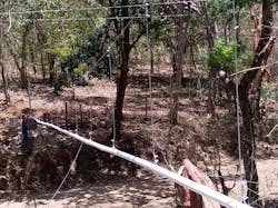 The EWB-Mines team designed and built suspension crossings over five gullies across a maximum distance of 100 ft (30 m). The pipelines over these gullies were constructed using extra-thick schedule-80 polyvinyl chloride (PVC) plastic to reduce sag and downwards force as much as possible. The EWB-Mines team designed and built suspension crossings over five gullies across a maximum distance of 100 ft (30 m). The pipelines over these gullies were constructed using extra-thick schedule-80 polyvinyl chloride (PVC) plastic to reduce sag and downwards force as much as possible.