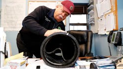 A Lindenhurst Department of Public Works official with a CheckMate® UltraFlex® In-Line Check Valve A Lindenhurst Department of Public Works official with a CheckMate® UltraFlex® In-Line Check Valve