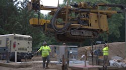 Prime contractor Lakeshore Engineering used a crane with rigging to lower the Beretta T46 Drilling Rig into the excavation as UMA&rsquo;s team provided direction.