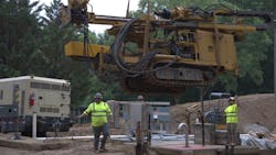 Prime contractor Lakeshore Engineering used a crane with rigging to lower the Beretta T46 Drilling Rig into the excavation as UMA’s team provided direction. Prime contractor Lakeshore Engineering used a crane with rigging to lower the Beretta T46 Drilling Rig into the excavation as UMA’s team provided direction.