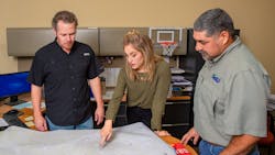 Members of the NBU team at work, resolving water leaks. Members of the NBU team at work, resolving water leaks.