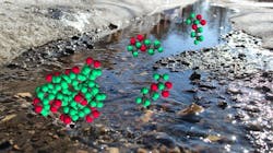 The photo illustration shows GenX molecules, the red and green circles, superimposed over a stream. the interaction between GenX and water lead to the formation of micelles, which occur in higher concentrations near surfaces, like the pebbles of the stream The photo illustration shows GenX molecules, the red and green circles, superimposed over a stream. the interaction between GenX and water lead to the formation of micelles, which occur in higher concentrations near surfaces, like the pebbles of the stream