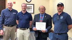 Pictured from left to right are David Dawson, deputy field director of VDH's Office of Drinking Water; Drew Langston, WCSA production manager; Dixon Tucker, chairman of the Virginia Optimization Program; and Joey Forster, WCSA lab manager. Pictured from left to right are David Dawson, deputy field director of VDH's Office of Drinking Water; Drew Langston, WCSA production manager; Dixon Tucker, chairman of the Virginia Optimization Program; and Joey Forster, WCSA lab manager.