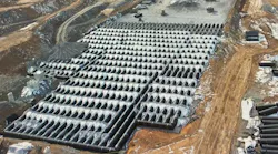 The largest of five retention beds was constructed from 24,500 ft (4.64 miles) of 60-inch diameter corrugated HDPE pipe. Photo shows the bed 50 percent completed.