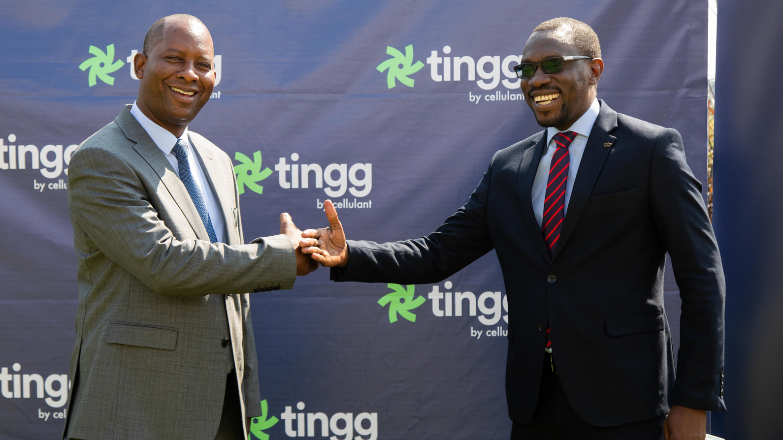 Minister of Water Sanitation Hon. Mr. Mike E. Mposha MP Cellulant and Zambia Country Manager Mr Gilbert H. Lungu.