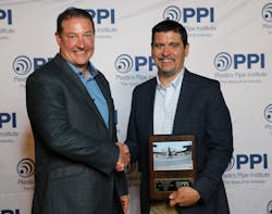 Jonathan Bittenbender, director, engineering of REHAU receives the Project of the Year Award from PPI President David M. Fink. Jonathan Bittenbender, director, engineering of REHAU receives the Project of the Year Award from PPI President David M. Fink.