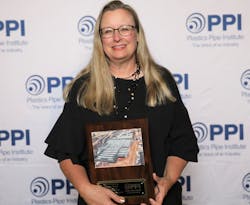 Tori Durliat, director of marketing for Advanced Drainage Systems, Inc. with the Project of the Year plaque. Tori Durliat, director of marketing for Advanced Drainage Systems, Inc. with the Project of the Year plaque.