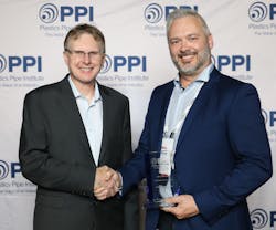 Lance MacNevin, P. Eng., (left) director of engineering for PPI's BCD, congratulates Mike Casavant. Lance MacNevin, P. Eng., (left) director of engineering for PPI's BCD, congratulates Mike Casavant.