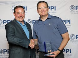 Fink (left) congratulates Greg Bohn. Fink (left) congratulates Greg Bohn.