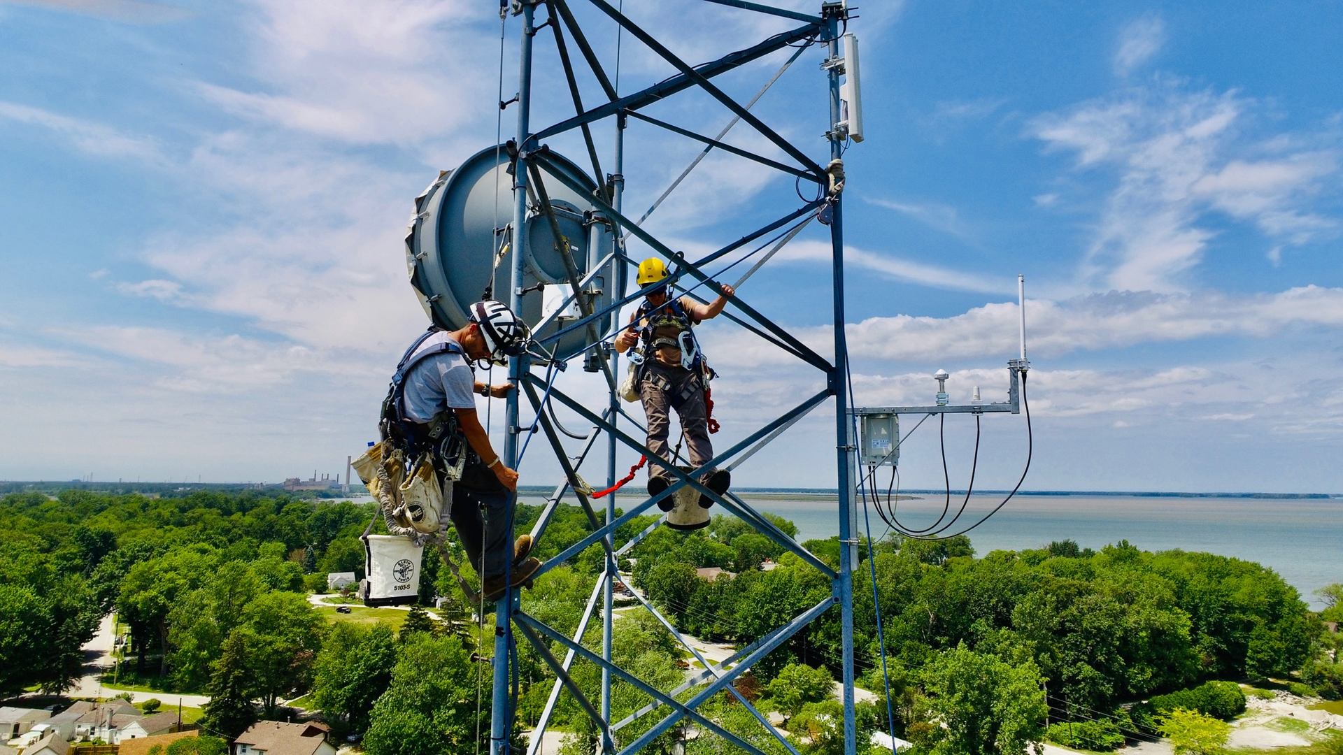 Workers install a new telecommunications gateway at the University of Toledo&rsquo;s Lake Erie Center