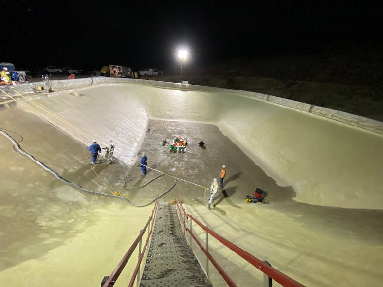 To address temperature and moisture concerns, the team worked into the night to apply the epoxy polyurethane coating to one of two reservoirs on base.