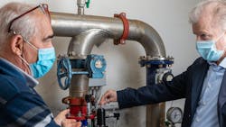 Antonio Gualtieri (left), Technical Manager for Water Leakage Detection at IRETI, and Marco Alberti, Sales Manager at GF Piping Systems Italy, fine-tuning a NeoFlow pressure regulating valve. Antonio Gualtieri (left), Technical Manager for Water Leakage Detection at IRETI, and Marco Alberti, Sales Manager at GF Piping Systems Italy, fine-tuning a NeoFlow pressure regulating valve.