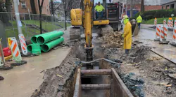 Crews on Centre Avenue installing the new sewer main.