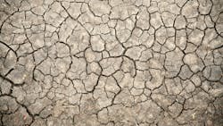 Dry, cracked soil in the Masai Mara Reserve of Kenya. Dry, cracked soil in the Masai Mara Reserve of Kenya.
