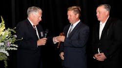 Ron Warren, previous Chairman of the Board, hands off the gavel to incoming chairman Matt Thiel. Ron Warren, previous Chairman of the Board, hands off the gavel to incoming chairman Matt Thiel.